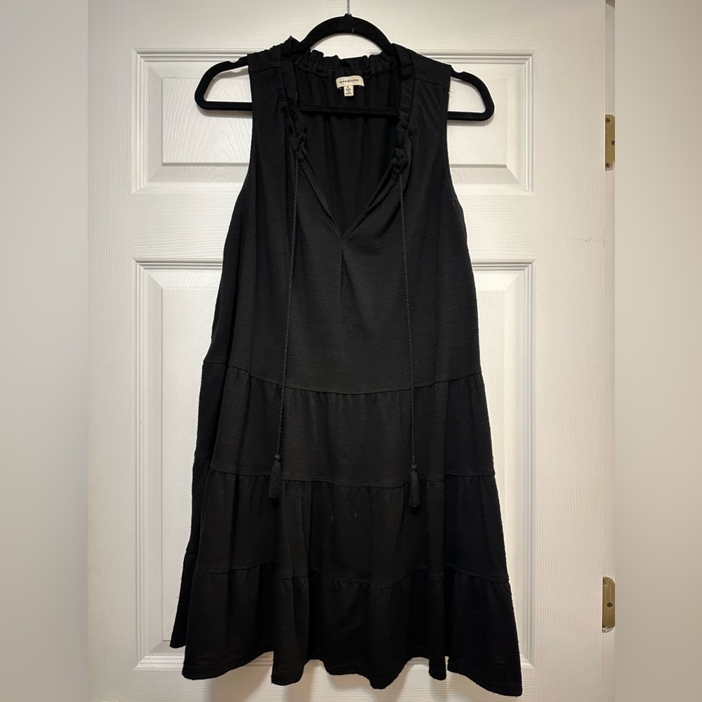 Precious black dress or top paired with jeans and wedges!